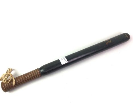 GEORGE III PAINTED TRUNCHEON, gilded "G R", on a black and grey painted background46cm long