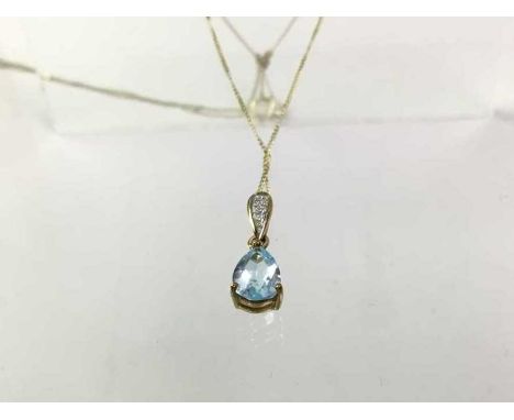 NINE CARAT GOLD TOPAZ AND DIAMOND PENDANT, on nine carat gold chainQty: 0.97g