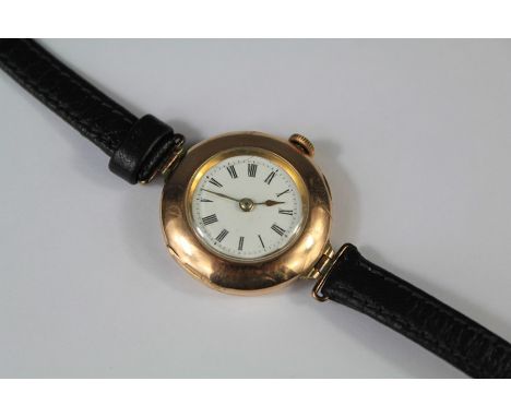 A Lady's 9ct Yellow Gold Wrist Watch. The watch having a white enamel face and Roman dial, no 3618980, approx&nbsp;