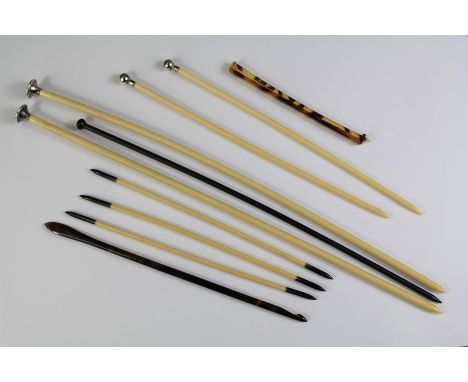 A Pair of Bone and Enamel Finial Knitting Needles. This lot also includes a pair of silver-topped knitting needles, stamped s