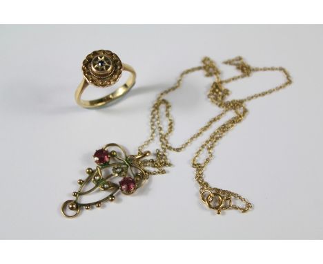 A 9ct Pink Garnet and Seed Pearl Pendant. The pendant on a 9ct gold chain with a 9ct gold ring, approx 4.9 gms.&nbsp;