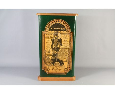 A Triangular Wooden Stick Stand. The stand depicting a transfers on green base reading "Umbrellas and Parasols, T. Power), to