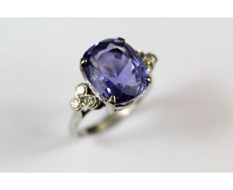 An Antique 9.35ct Ceylon Natural Blue-Violet Ceylon Sapphire and Diamond Ring. The colour-change cushion-cut sapphire approx 