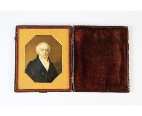 A Victorian Portrait Miniature. The miniature depicting a gentleman, approx 7 x 9 cms within a maroon leather case.