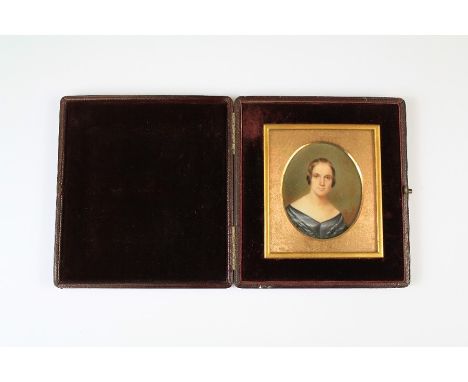 A Victorian Portrait Miniature. The miniature depicting a young woman, approx 7.5 x 8.5 cms within a maroon leather case.