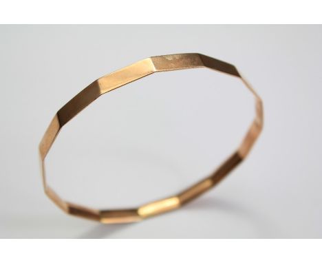 A 9ct Rose Gold Bangle. The multi-faceted bangle bearing Chester hallmarks, dated 1926, approx 18 gms.