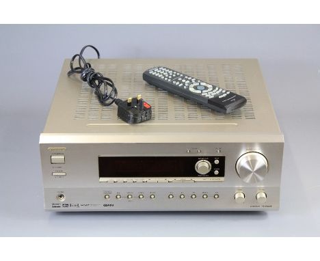 An Onkyo TX-DS595 AV Amplifier/Receiver. The 380 watt receiver with 5.1 Dolby surround sound, in brushed steel finish with re