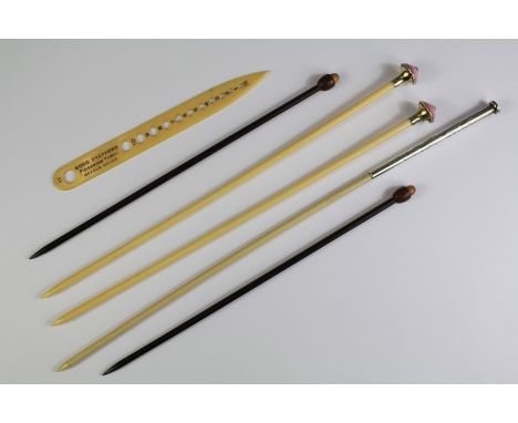 A Pair of Bone and Enamel Finial Knitting Needles. This lot also includes a large silver-topped knitting needle and a 'Good S