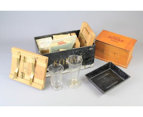 An Early 20th Century Photographic Kit. The kit including a Kodak Automatic No 2 Folding Pocket Brownie camera, Kodak Film an