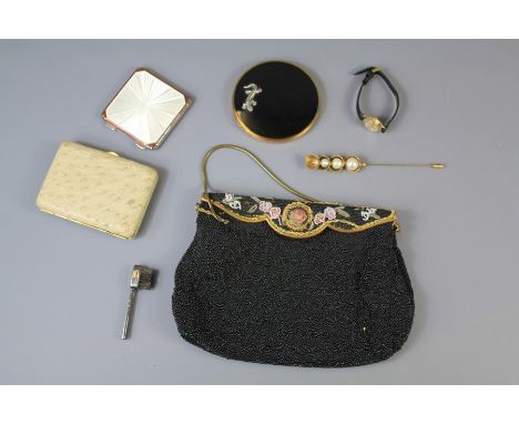 A Circa 1920's Vintage Beaded Handbag. This lot includes a white enamel compact, ostrich-skin cigarette case, black enamel co