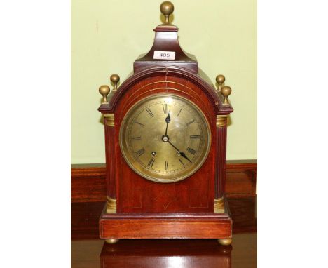 A Regency style inlaid striking mantel clock 