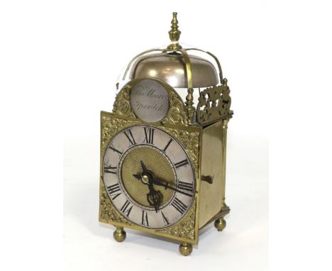 A miniature brass striking lantern clock, early 20th century, four posted case, side doors and pierced frets, ball feet, arch