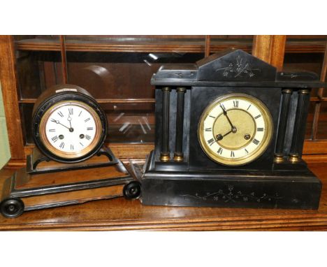 A striking mantel clock and a black slate striking mantel clock 