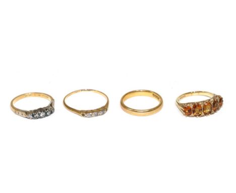 Two 18 carat gold gemset rings; an 18 carat gold band ring and a 9 carat gold five stone ring Gemset rings - Finger sizes I1/