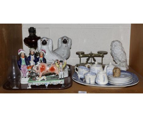 A reproduction Staffordshire pottery figure of a bull fighter, a pair of seated spaniels, Victorian oil lamp, blue and white,