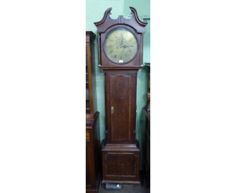 An oak eight day longcase clock, dial later signed R Seaton, one weight missing 