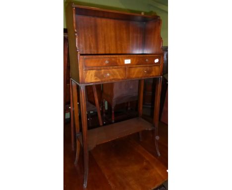 A book trough raised on four legs with a shelf stretcher 