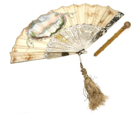 A mother of pearl fan with carved sticks and paper mount, decorated with a pastoral scene, 27cm, together with a parasol hand