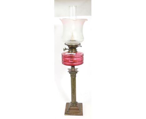 Cranberry glass and brass oil lamp 