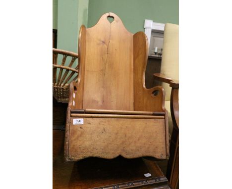 An early 20th century child's rocking commode chair 