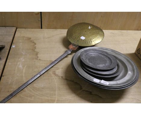 A brass and copper warming pan, late 17th century, with foliate decoration and steel handle, 110cm long; a pewter basin; two 