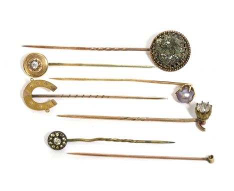 Seven various stick pins, including a diamond set and pearl set examples  (7)14.89g gross. 