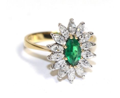 An 18 carat gold emerald and diamond marquise cluster ring Finger size N, 4.29g gross.