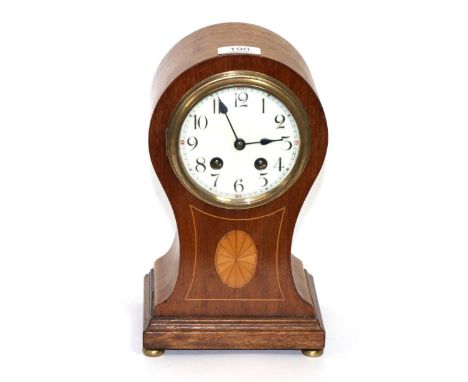 An inlaid balloon shaped striking mantel clock 