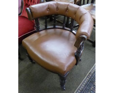 A Victorian mahogany smoker's bow chair, button-back leather upholstery