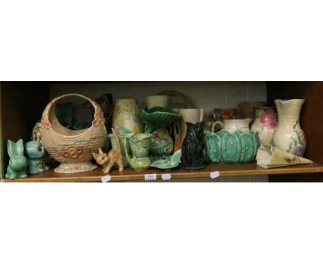 A shelf of 20th century ceramics including Sylvac, Beswick, Dartmouth, Bradford, etc