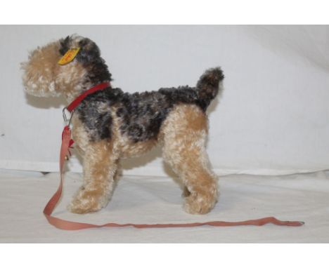 A Steiff Classic 1935 replica fox terrier, titled "Fellow", having a  circular white paper chest tag, collar, and lead, and m