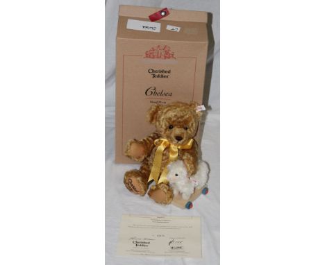 A Steiff North American exclusive teddy bear, "Chelsea", limited edition 2475 of 5000, having blonde mohair body, holding toy