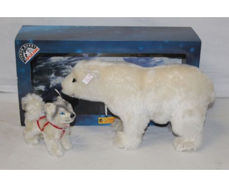 A Steiff Yukon Quest "Polar Bear", limited edition 2000 of 3000, comprising a polar bear and a husky, both displayed in their
