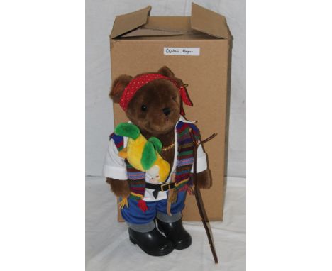 A Lakeland Bears teddy bear, titled "Captain Morgan", wearing a red polka dot headband bandana, a woolen cardigan, and having