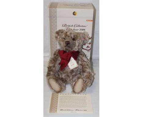 A Steiff British Collector's 2006 teddy bear, titled "Old Brown Bear", limited edition 758 of 3000, wearing a deep burgundy s