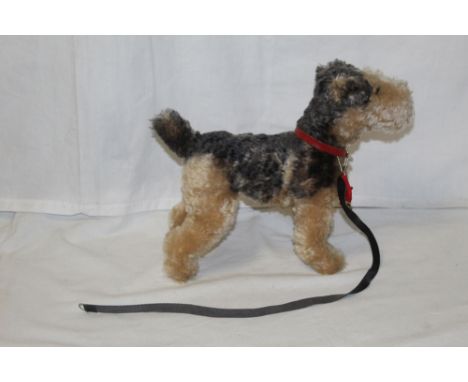 A Steiff Classic 1935 replica fox terrier, titled "Fellow", measuring 28cm tall, and retaining his original circular chest ta