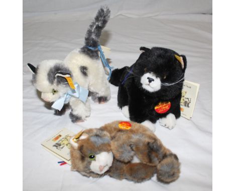A Steiff Classic replica 1952 'Katze' cat, having a metal button and yellow label to its ear, measuring 14 cm tall excluding 