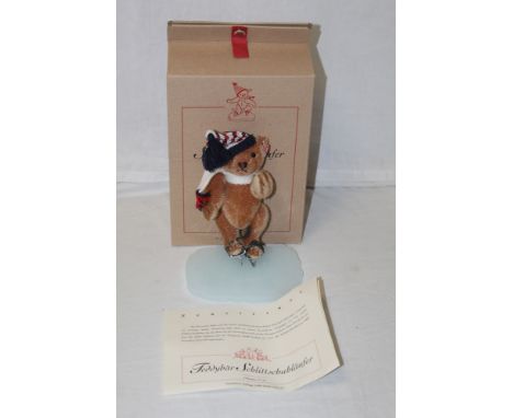 A Steiff "Teddy Bear Ice Skater", limited edition 1134 of 3000, having a reddish brown mohair covered body, wearing a pair of