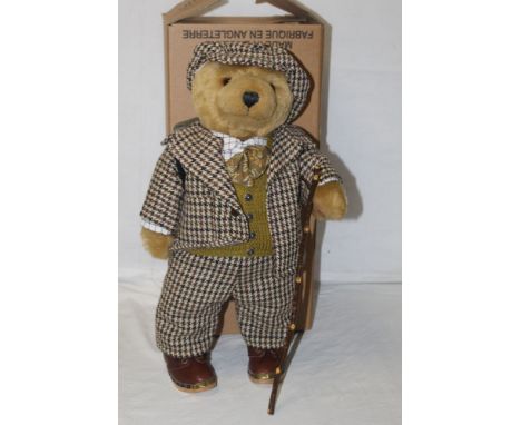 A Lakeland Bears teddy bear, titled "Colonel", having a light brown mohair covered body, tweed suit and flat cap, woollen car