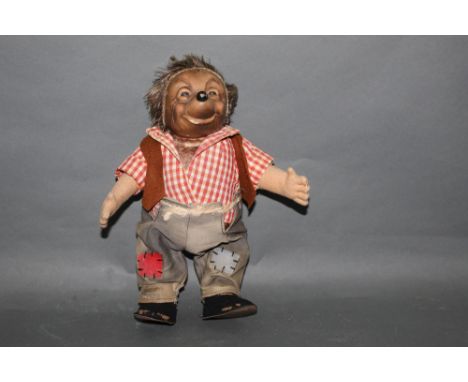 A group of three Steiff Mecki hedgehogs, comprising an early 1950's Steiff Mecki, with a rare straight fringe, measuring 29cm