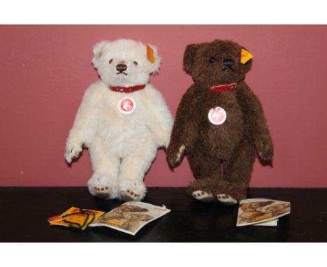 Two Steiff Classic Club teddy bears, with red and white circular chest tags, in brown and white, each measuring 18cm tall.