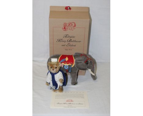 A Steiff "Teddy Bear King Balthazar with an Elephant", limited edition 306 of 1500, the bear wears a cream coloured shirt dec