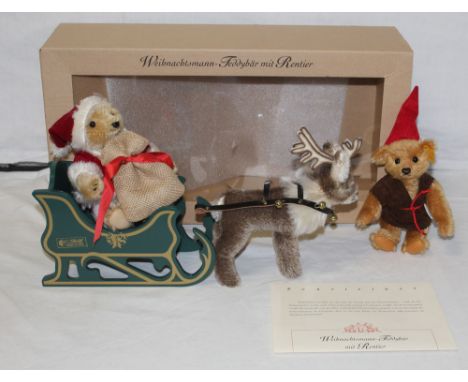 A Steiff "Father Christmas Teddy Bear with Reindeer", limited edition 2058 of 2500, comprising a blonde mohair plush Father C