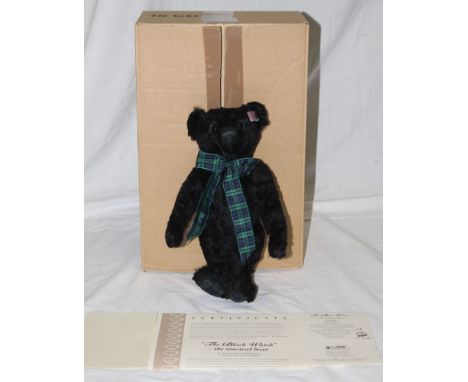 A Steiff musical teddy bear, "The Black Watch", limited edition, having a black coloured mohair body, with the Black Watch ta