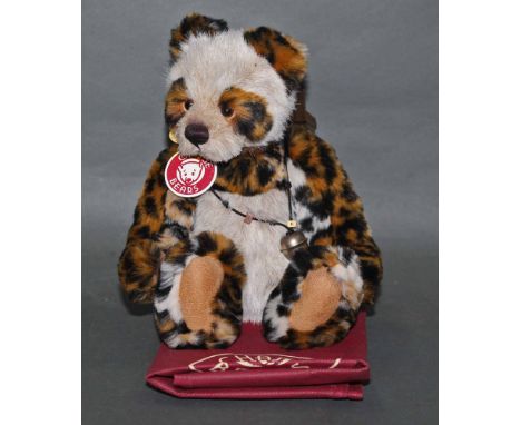 A soft plush "Bart" Charlie Bear, CB124917A, having fawn fur covered body, leopard print limbs, ears, and eye patches, wearin