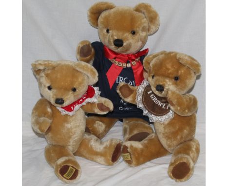 A group of three Merrythought teddy bears, all with blonde mohair covered bodies, comprising a "Jack Field" teddy bear, weari