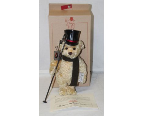 A Steiff "Teddy Bear Christmas Caroler", limited edition 971 of 2000, having a blonde mohair covered body, wearing a scarf an