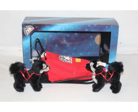 A Steiff Yukon Quest "Sledge with basket", limited edition 1998 of 3000, comprising a sledge and basket, plus two Steiff moha