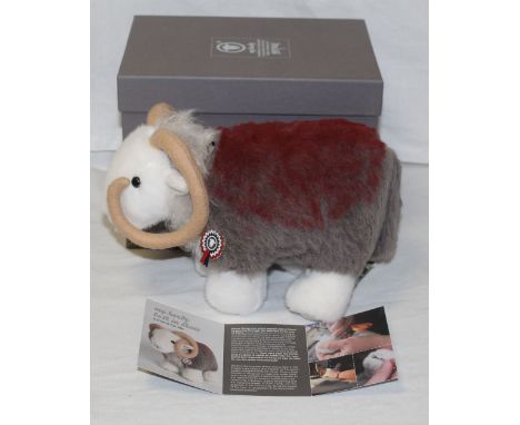 A Merrythought "My Herdy Best In Show" Herdwick sheep soft toy, wearing a hand stitched enamel winner's rosette, having tradi