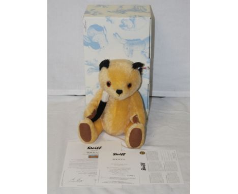 A Steiff "Sooty" teddy bear, limited edition 416 of 2000, having a yellow mohair covered body, holding a wand, and measuring 